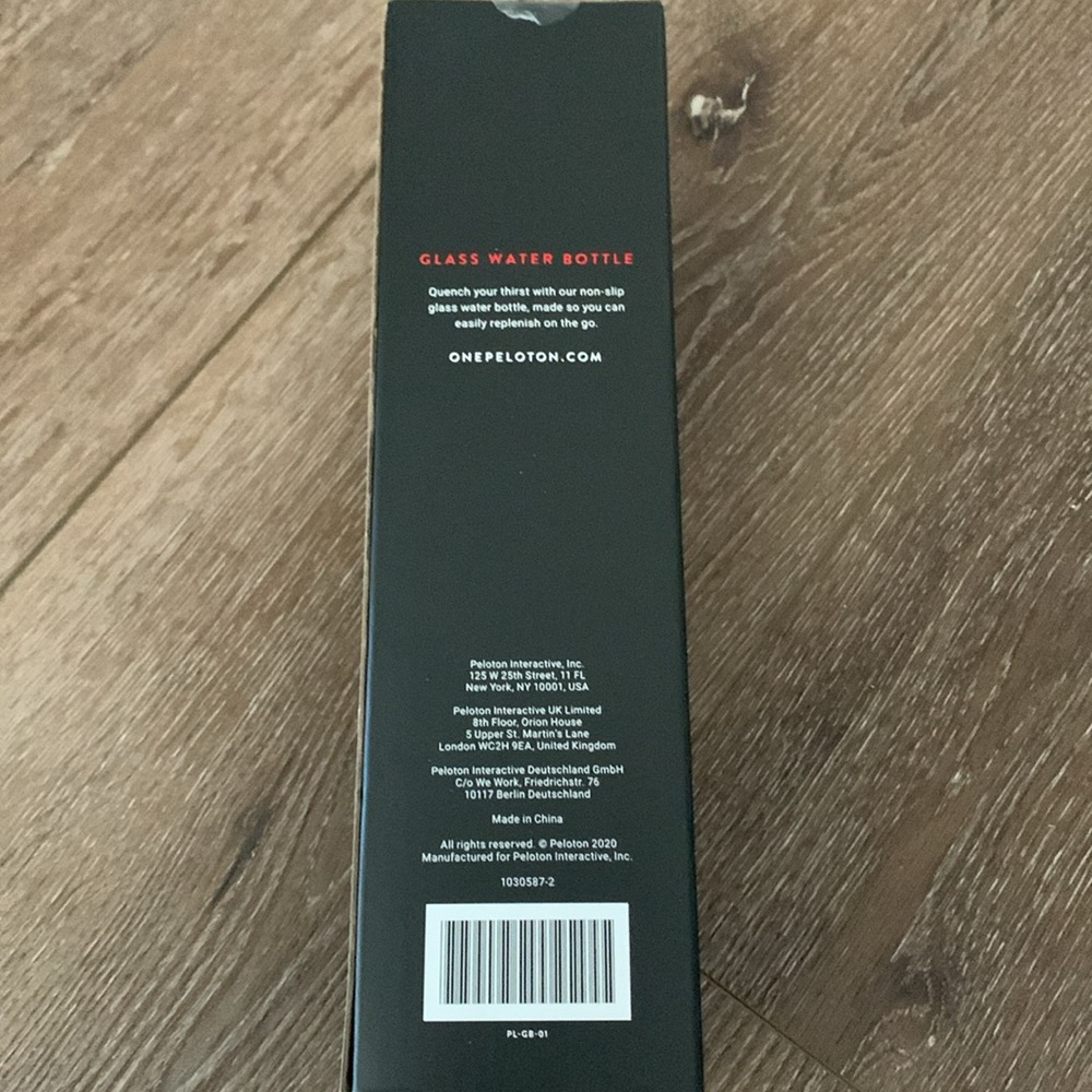 Peleton New Glass Water Bottle with Black Silicon Wrap 16 Oz capacity. - Picture 2 of 2